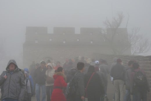 5 a) A Lookout Tower at The Great Wall of China in a heavy fog