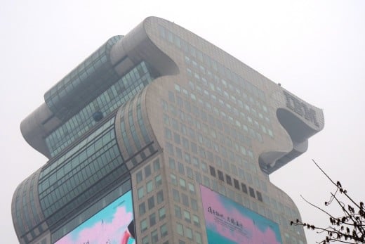 10 b) A modern skyscraper building overlooking Olympic Park