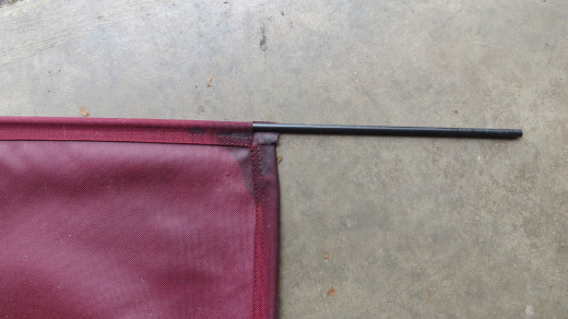 Original ballistic nylon bedding material came with sleeves sewn into the edges.  Four plastic rods were included, the plastic rods are inserted in tot he sleeves and the edges are then inserted into grooves on the frame.