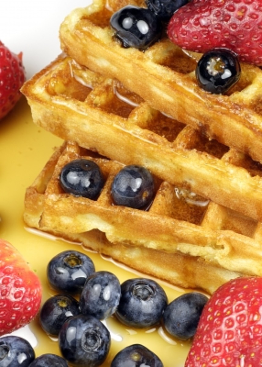 Belgian waffles with blueberries, strawberries and maple syrup