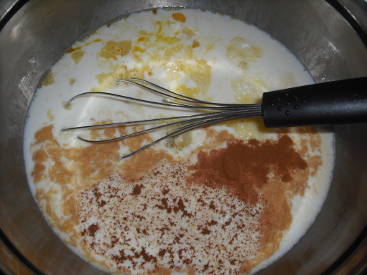 Place the eggs, milk, sugar, melted butter, vanilla, cinnamon, nutmeg and salt in a large mixing bowl.