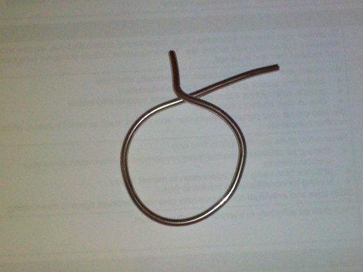 Bend end back about 90 degrees and snip other end about one inch.