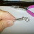 This loop is side facing for stringing with cord or chain.