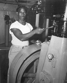 US merchant marine worker in a standard issue white T=shirt. circa 1940s