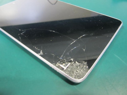 This troubled Nexus 7's bad owner dropped it, onto cement, from a moving car.