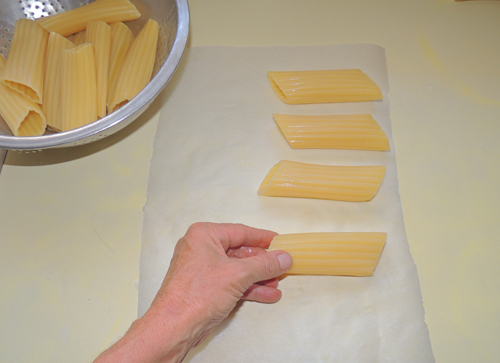 your shells should be al dente by now - remove them, pat lightly dry, and place on clean surface