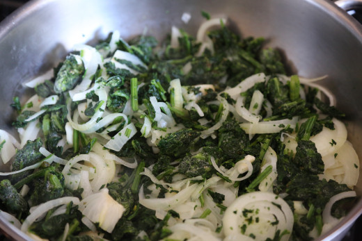 Spinach and onion getting ready for pizza. 