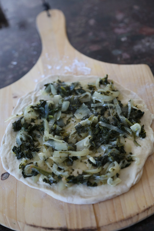 Green pizza ready to go into oven!