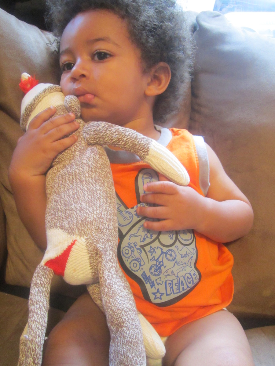 My son, Julian, with one of the many sock monkeys my great grandmother made.
