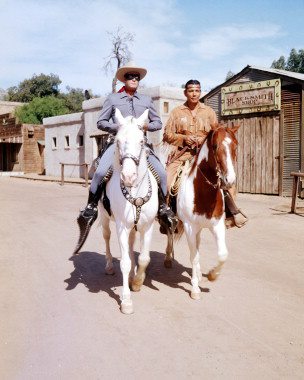 The Lone Ranger and Tonto riding Silver and Scout.