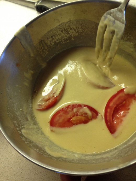 Gently place the tomatoes in the batter, being careful not to stir them.  This keeps them from falling apart. 