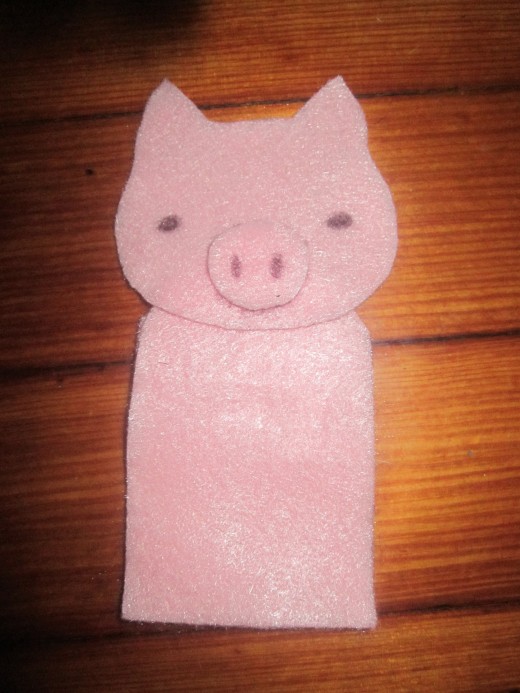 Start by gluing/sewing the body pieces together, then add the head and other felt features.  Lastly add any small details.  I just used a pen because that's what I had readily available at the time. 