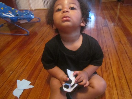 Juju playing with his new panda finger puppet.