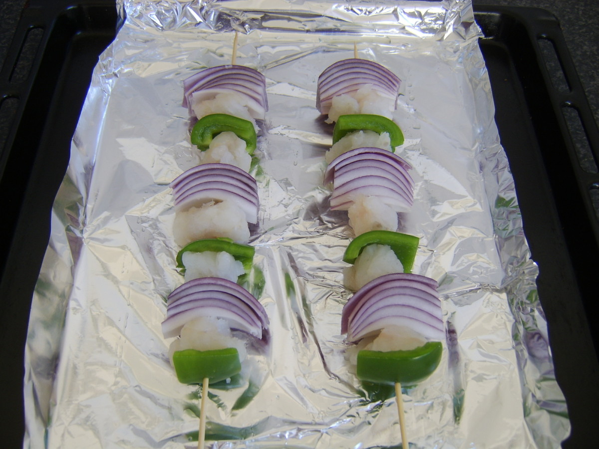 Ling, green pepper and red onion shish kebabs ready for grilling