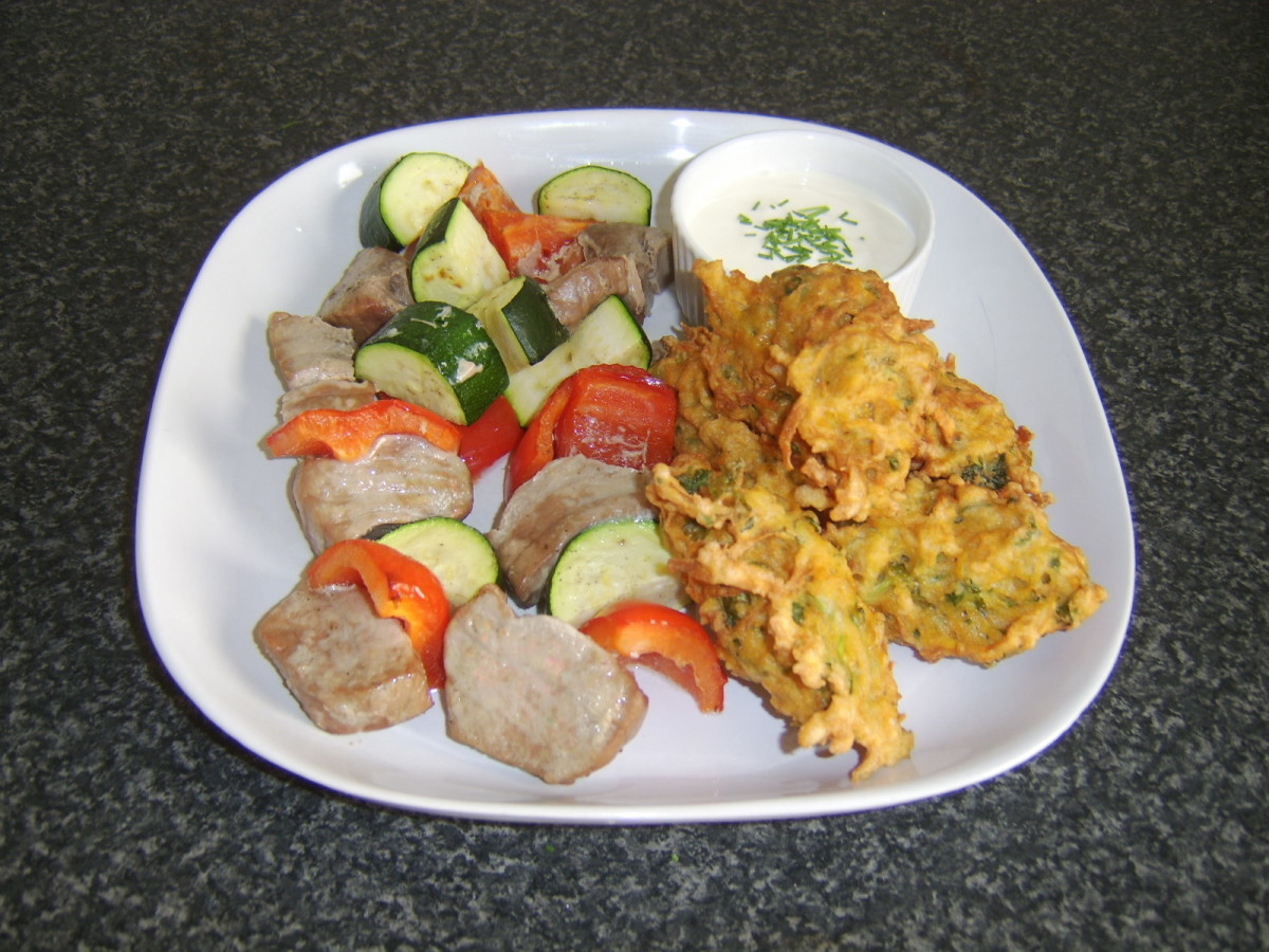 Tuna and vegetable shish kebabs are served with sweet potato fritters and a soured cream dip