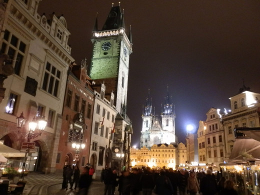 The fairytale-like Old Town Square in Prague with the Astronomical Clock Tower rising on the left