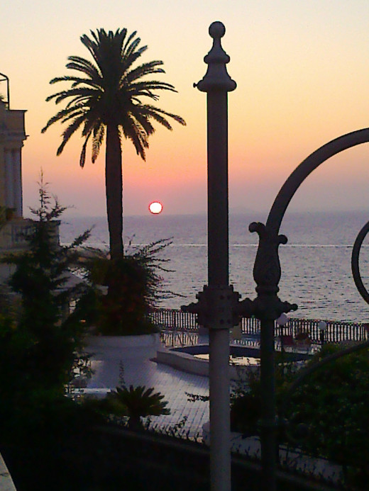 Sun setting slowly into the Bay of Naples, seen from the balcony of The Foreigner's Club in Sorrento, Italy