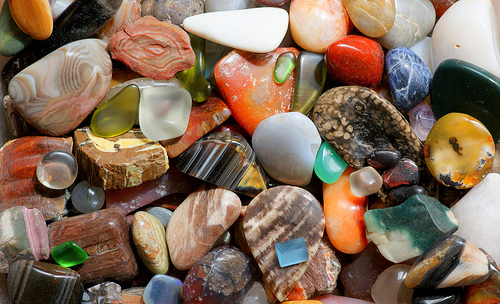 A mix of polished gemstones suitable for crystal healing. 