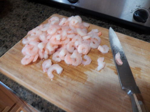 Chop shrimp for crab cake recipe.