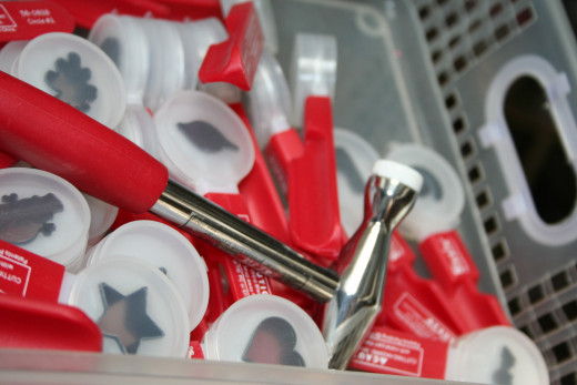 Paddle dies stored in a plastic bin with handles for easy access from a higher shelf!