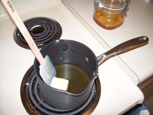 Melt the honey and butter together over medium heat.  Be sure to stir it often to avoid burning.