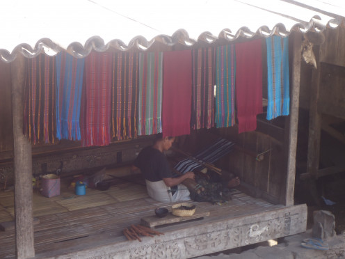Flores: A villager doing Ikat weaving making an Ikat bag by traditional methods and a traditional Ikat pattern. 