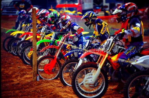 Some colorful motocross action. I enjoy Motocross photography, because of the bright colors and the good action of dirt flying and motorbikes jumping through the air, and then of course the crowded start line looks cool also. 