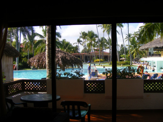 This is the view looking out onto the patio from the sitting area. Overlooking the main pool.