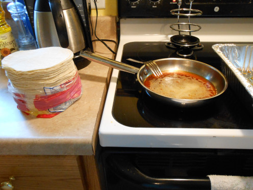 Prepare your ingredients and work area with either a left to right or right to left flow.  Making cheese enchiladas is a quick process.  You will want to have all ingredients easily accessible when you get started.  Mine starts on the left side.