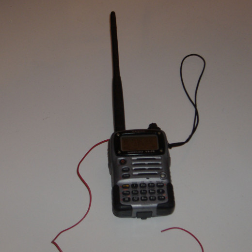 Something as simple as a wire wrapped around the base of the antenna of one of these tiny transceivers can make a huge difference in how well the two people using them can communicate.