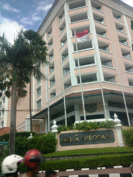 in front of the Melia Purosani hotel in Jogjakarta, Indonesia. Photo taken from our car. ;)