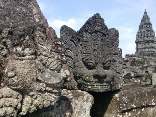 Figures on the rocks. To me, it looks like the Cheshire cat from Alice in wonderland.