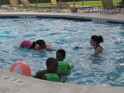 Members of the Graves family enjoy the swimming pool before the barbeque.