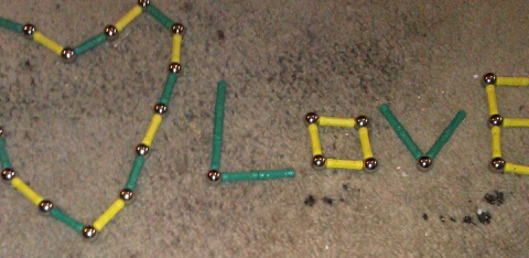Give a child beads in the sand.  The first thing thought of to create.