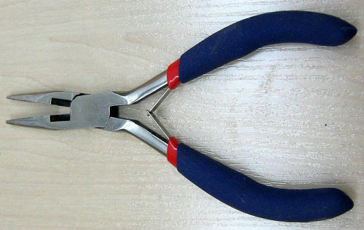 Chain nosed pliers with wire cutter. This type of pliers have many uses in jewellery making, however it is better to avoid those with serrated jaws as they can damage wire and other components. 