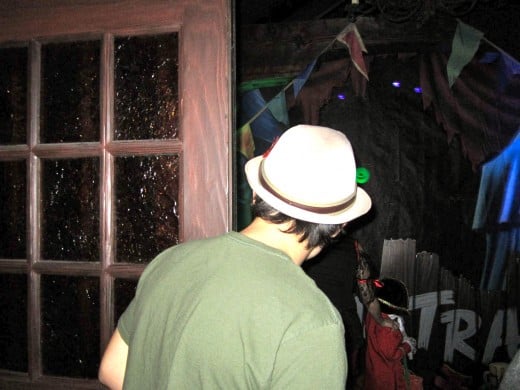 Heading into a Trick or Treat station in Fantasyland. Inside there was Halloween themed music and decorations along with some fun lighting. 