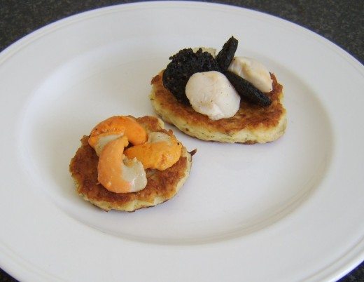 Assembling scallops and black pudding on potato cakes