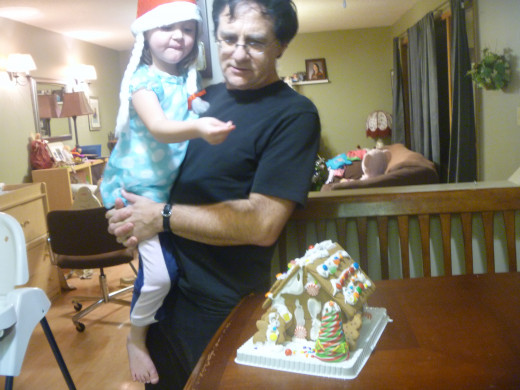 Creation of a gingerbread house...father and daughter 