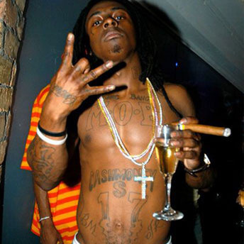 Cross worn as a status symbol. This is the guy that, in one song, called himself a disease on the universe.