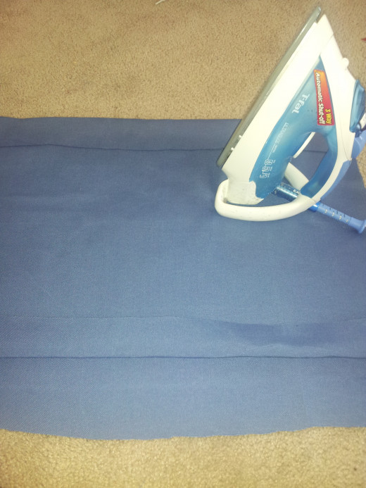 You are seeing both squares.  I used two pieces of fabric and tried to make sure they were the same size.   I didn't measure.  You should because after step 4, I had to cut more fabric off.  