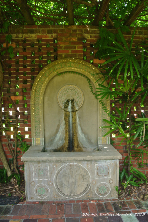 Concrete and mosaic peacock fountain by William Mercer.  This fountain is located in the English Gardens.