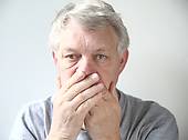 A man affected by the problem of bad breath