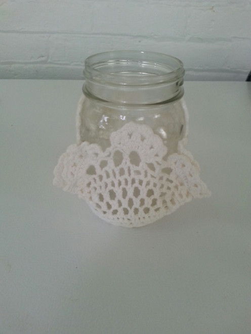 Lightly cover the jar with spray adhesive, place the lace doily as desired and allow to dry.