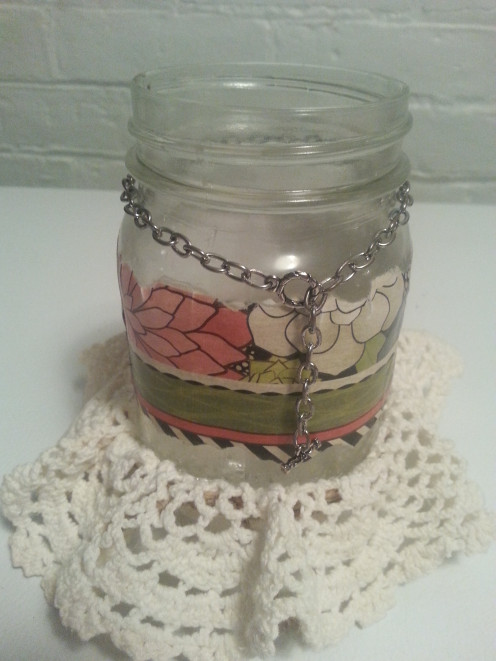 Tear a piece of scrapbook paper using a craft ruler, or freehand if you prefer, and adhere to the jar using Mod Podge.