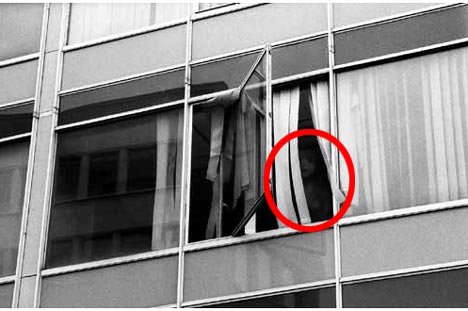 In the above photo the ghost of the little girl can be seen looking out the window. 