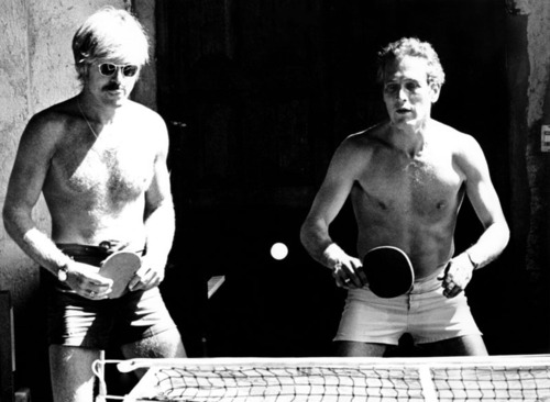 Actors Robert Redford and Paul Newman participate in a game of table tennis.