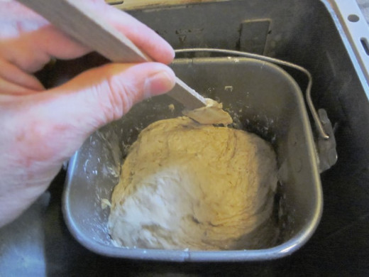 Giving the bread dough a helping hand. Photo by: timorous