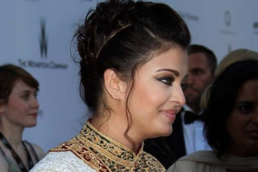 Post-pregnancy baby fat under Aishwarya Rai's chin can be seen but she carried herself with confidence at the Film Festival in 2012 