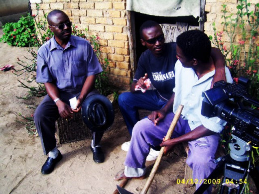 Director Edmore Ndlovu chats with cast on one of the locations for "Sores of Emmanuel". 