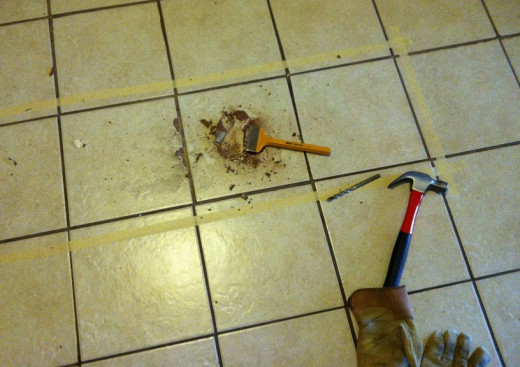 Starting hole punched out with a carbide tipped hammer-drill masonry bit.